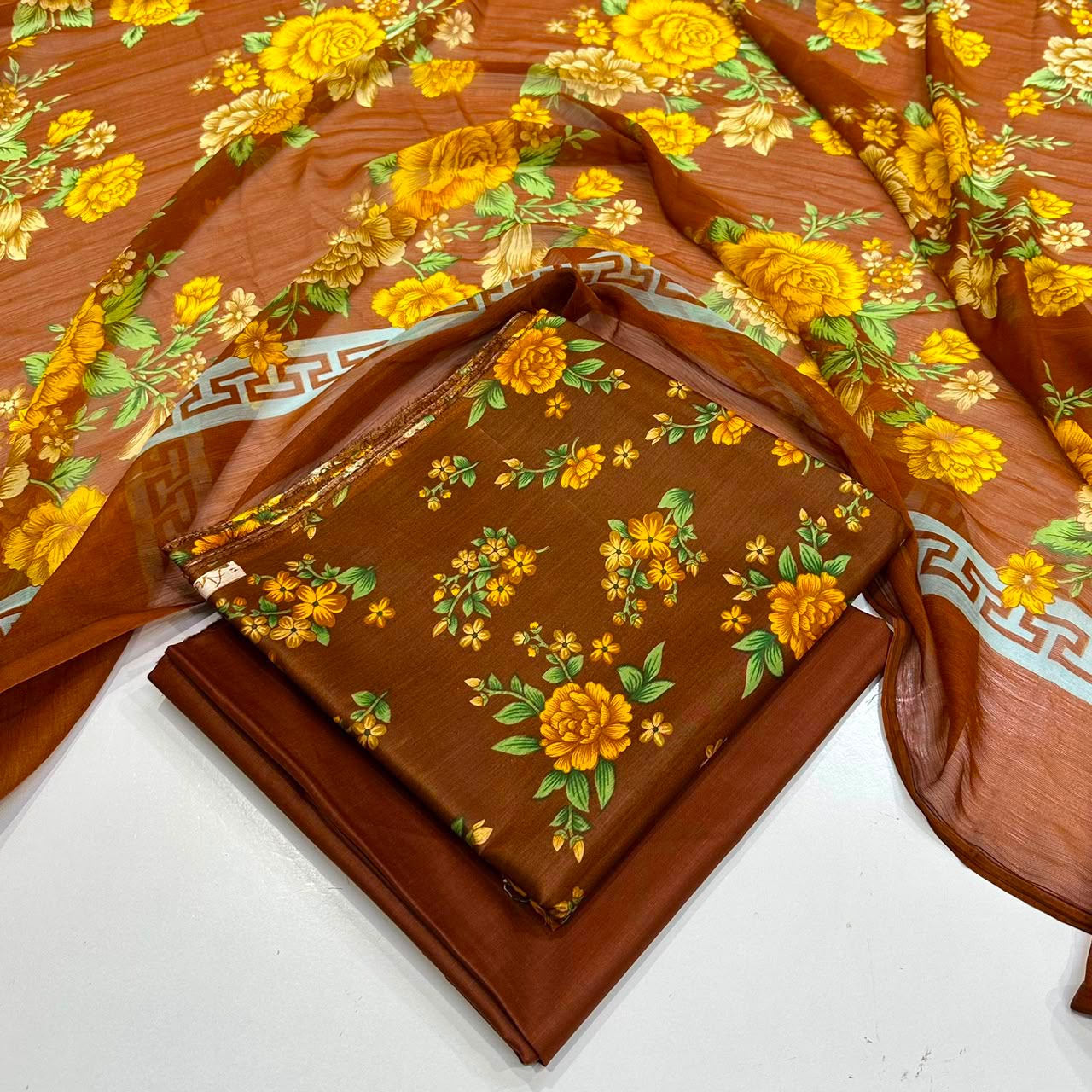 lawn 3 piece suit in yellow and mustard  floral print and a matching sheer dupatta