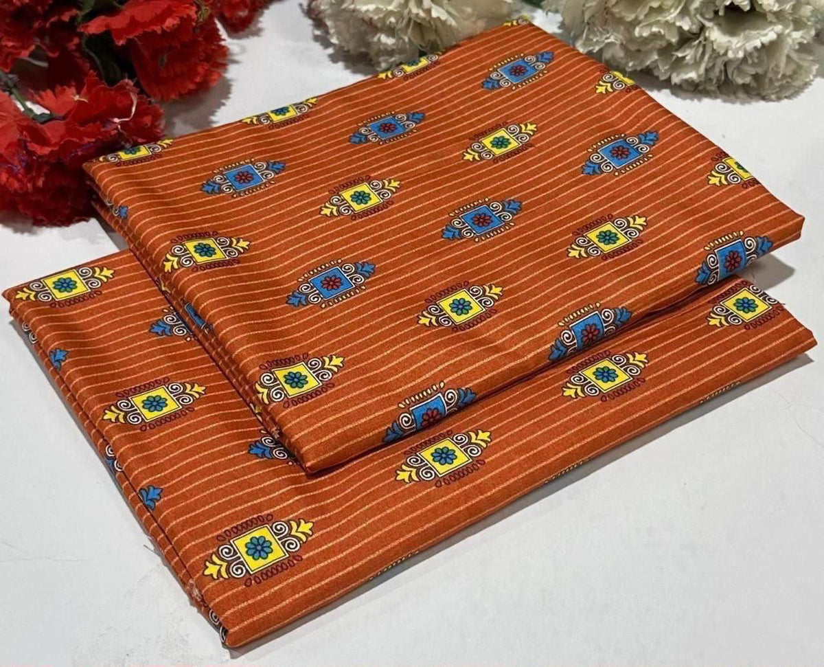 2 piece suit in orange with  blue, yellow, and green geometric motifs