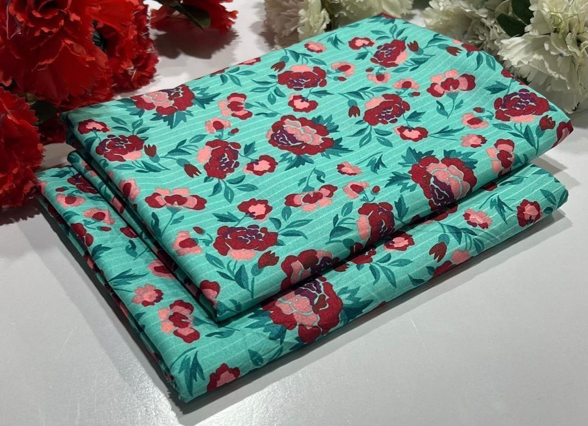 2 piece suit in blue with red flowers on a turquoise background