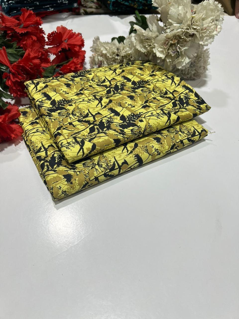 2 piece suit in yellow with a black abstract floral or brushstroke pattern