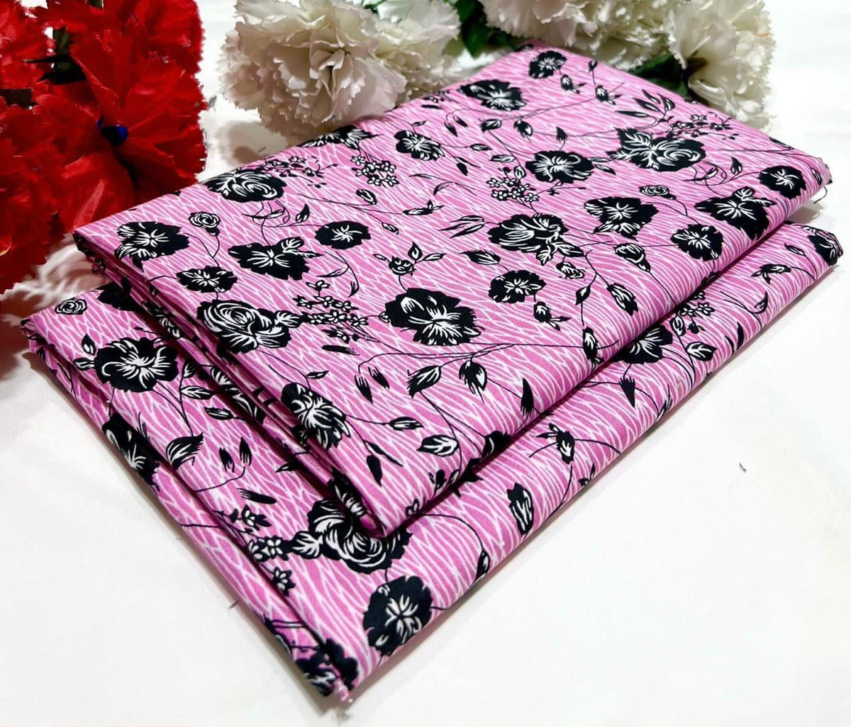 2 piece suit in Pink with black floral pattern