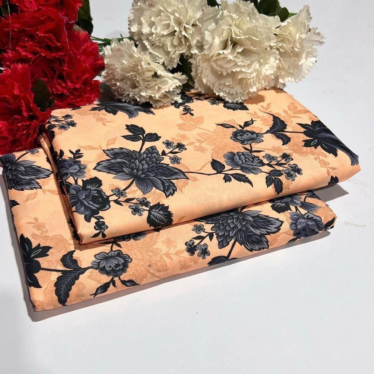2 piece suit in peach with black flowers