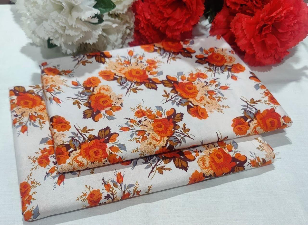 2 piece suit in white with orange and red flowers