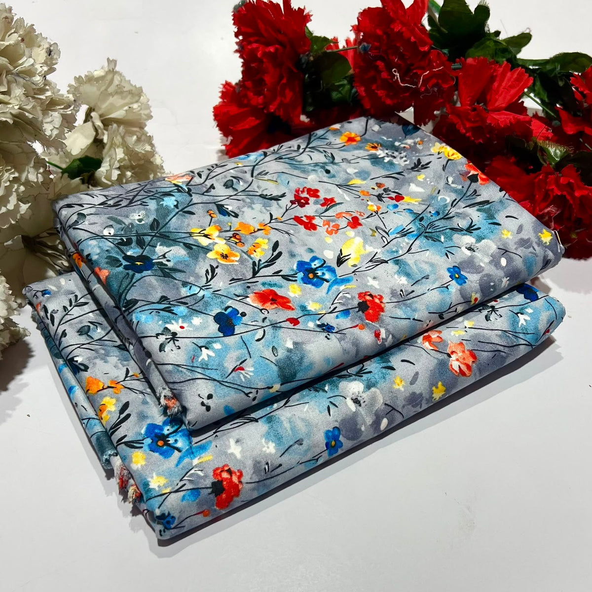 2 piece suit in blue with colorful floral pattern
