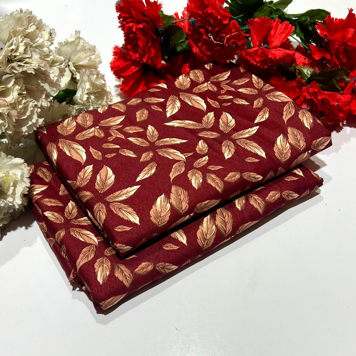 2 piece suit in red with a metallic gold leaf pattern
