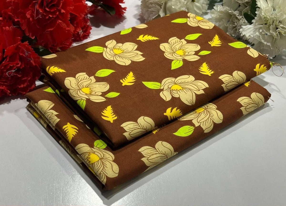 2 piece suit in brown fabric with a floral print featuring large cream flowers
