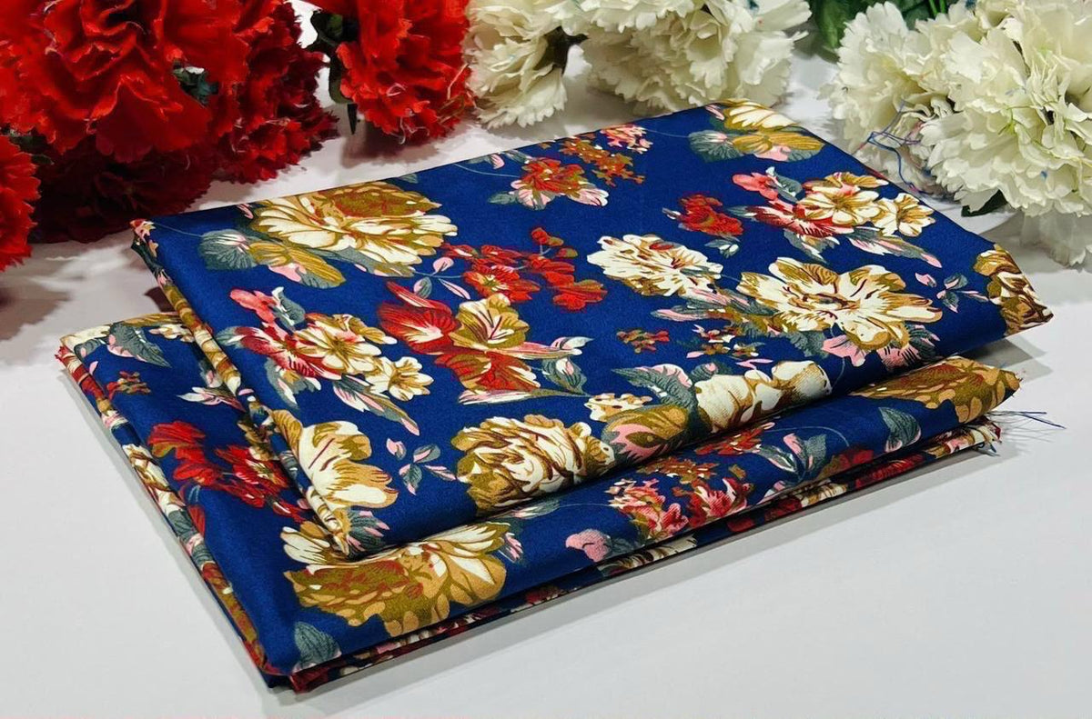 2 piece suit in blue with a large floral print in red, yellow, white