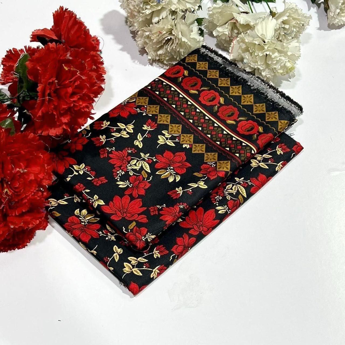 Ladies 2 piece summer cotton suit in red floral print and a decorative border with gold, red, and green motifs