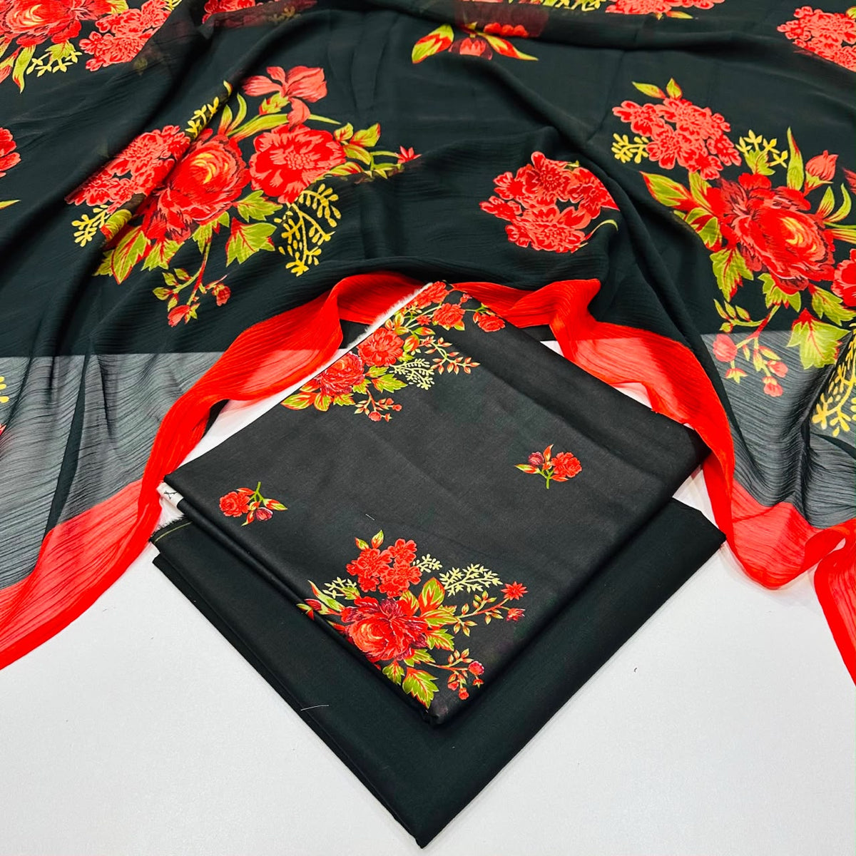 lawn 3 piece suit in Black with a matching sheer red dupatta 