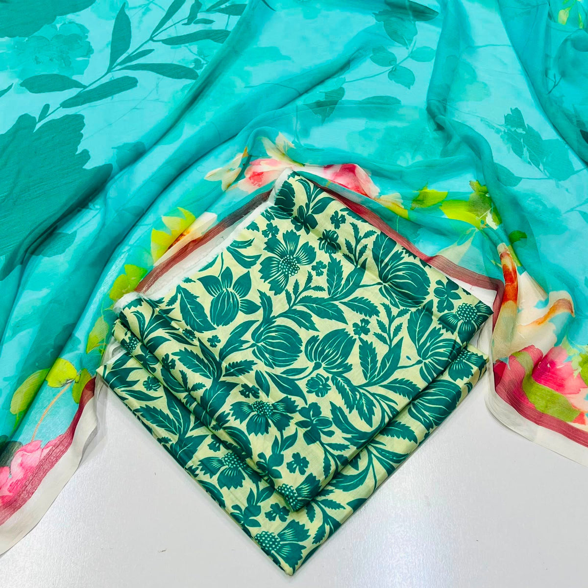 lawn 3 piece suit in teal and dupatta with a pink and green floral print