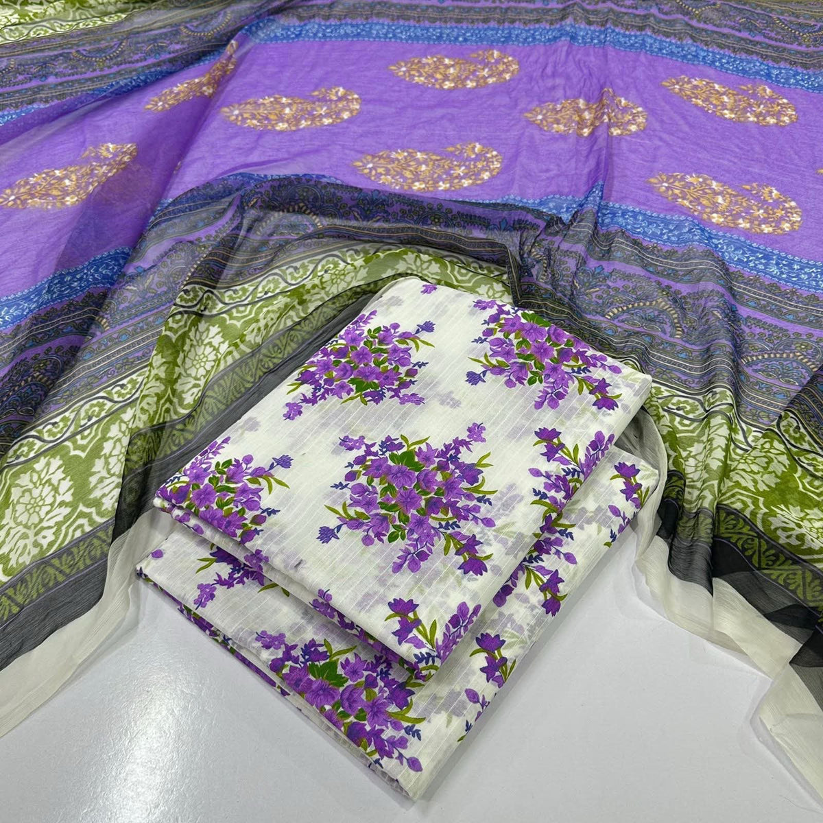 lawn 3 piece suit in purple  with gold paisley patterns, a green and gray patterned dupatta