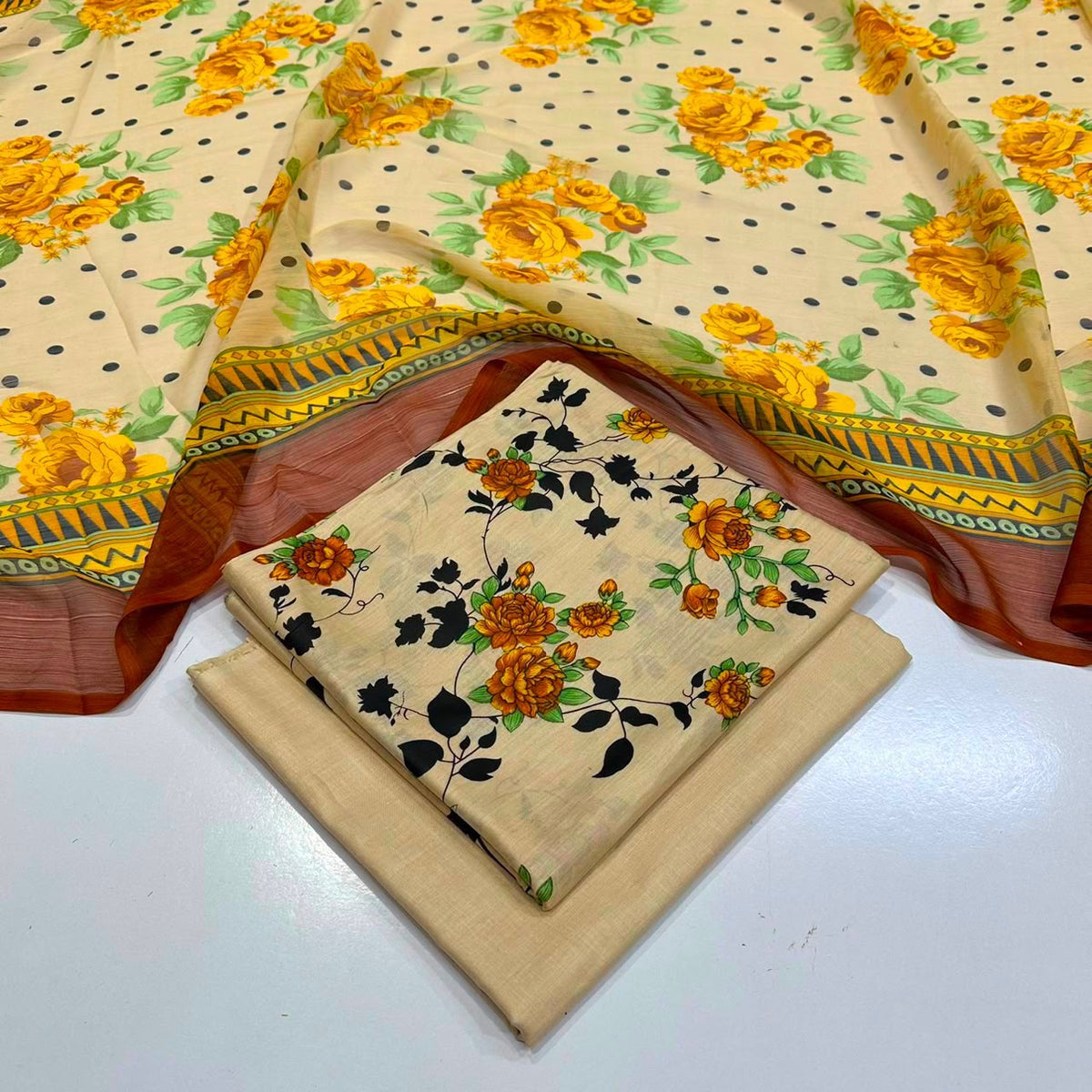 lawn 3 piece suit in beige with a yellow rose floral print, black polka dots