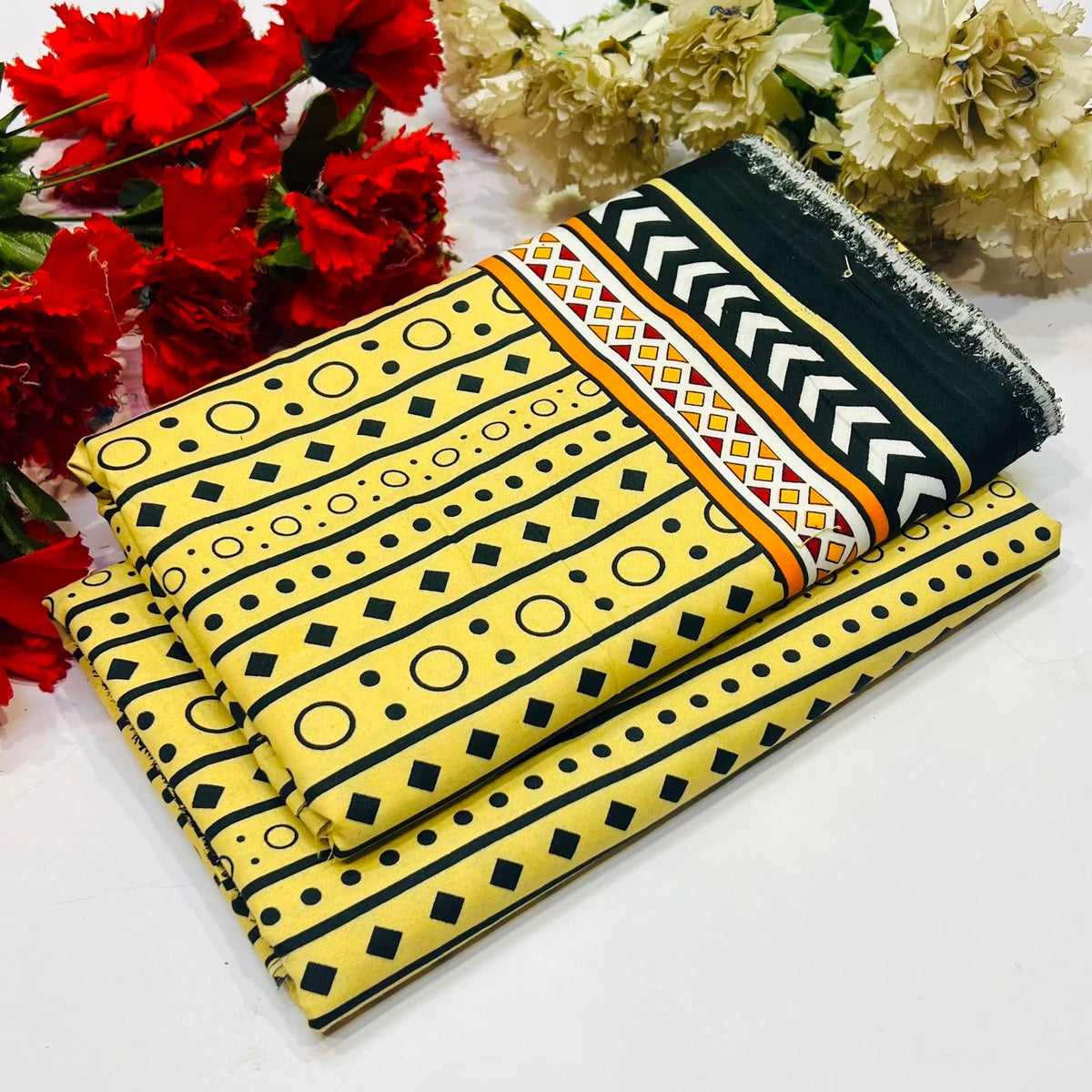2 piece suit in yellow with black geometric patterns