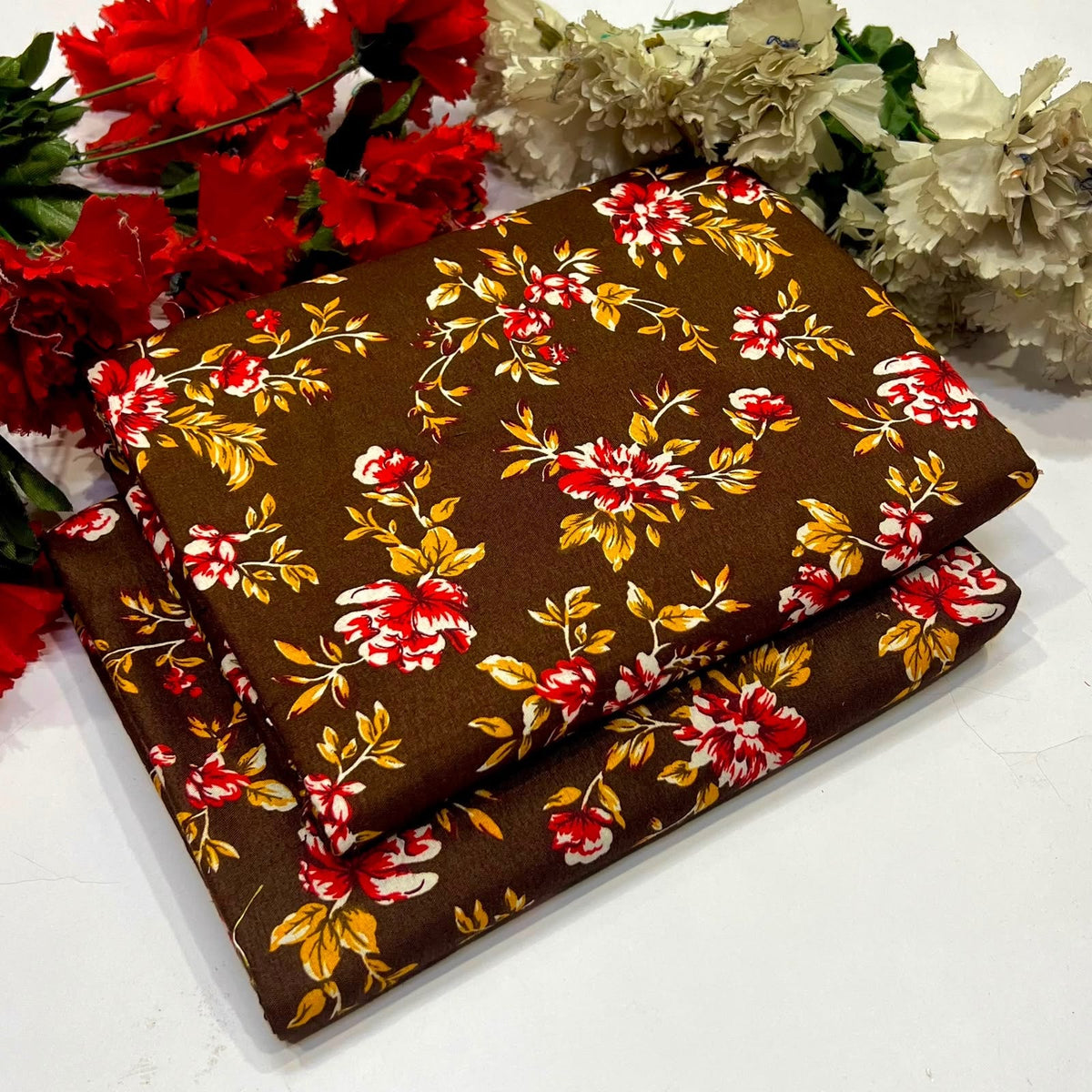 2 piece suit in brown with red, yellow, and white floral pattern