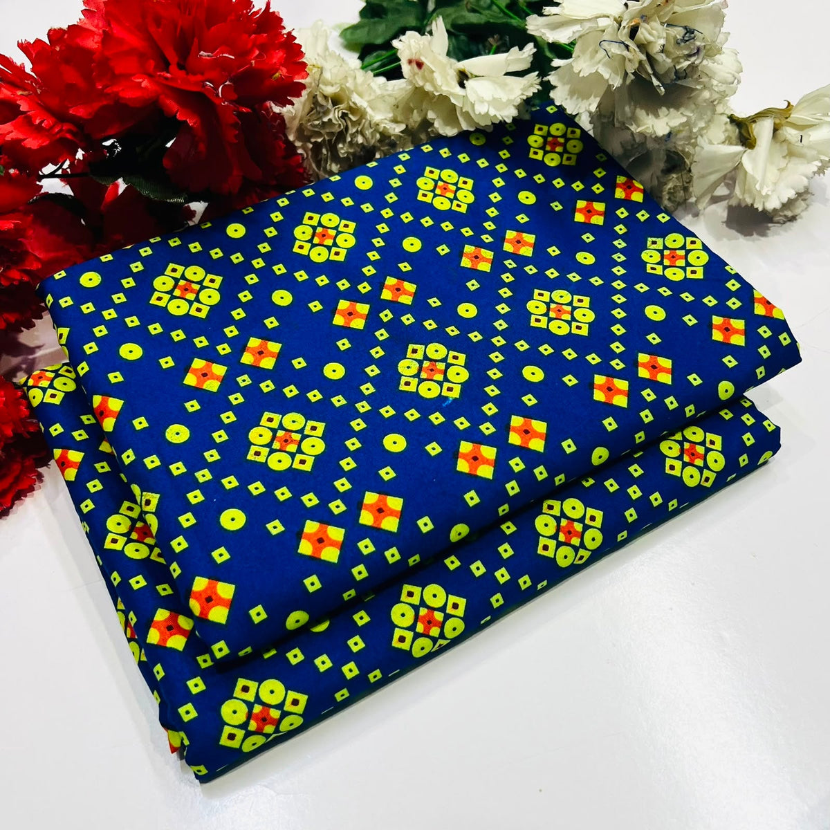 2 piece suit in blue  with a yellow and red geometric pattern