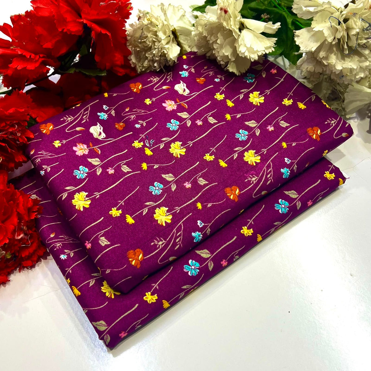 2 piece suit in purple with a colorful floral and vine pattern