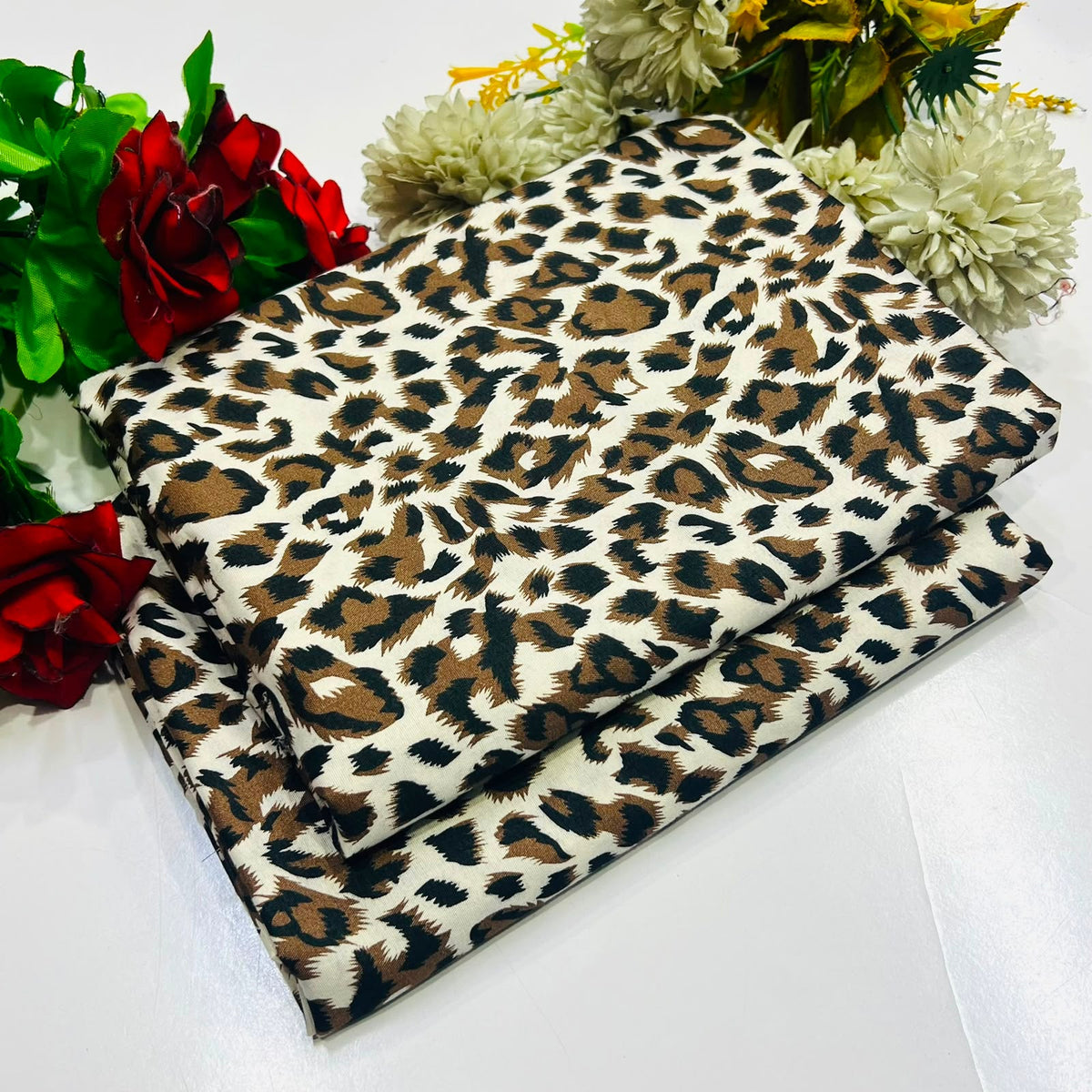 2 piece suit in leopard print pattern in black, brown, and beige