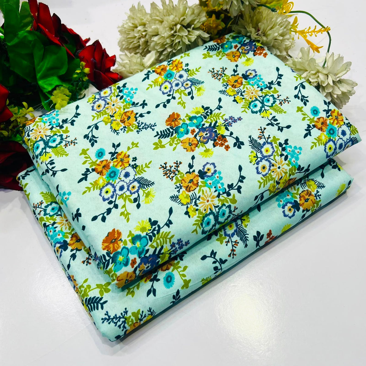 2 piece suit in light mint green with a colorful floral print