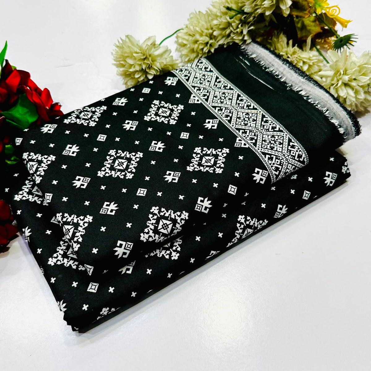 2 piece suit in Black and white printed with a traditional bandhani pattern