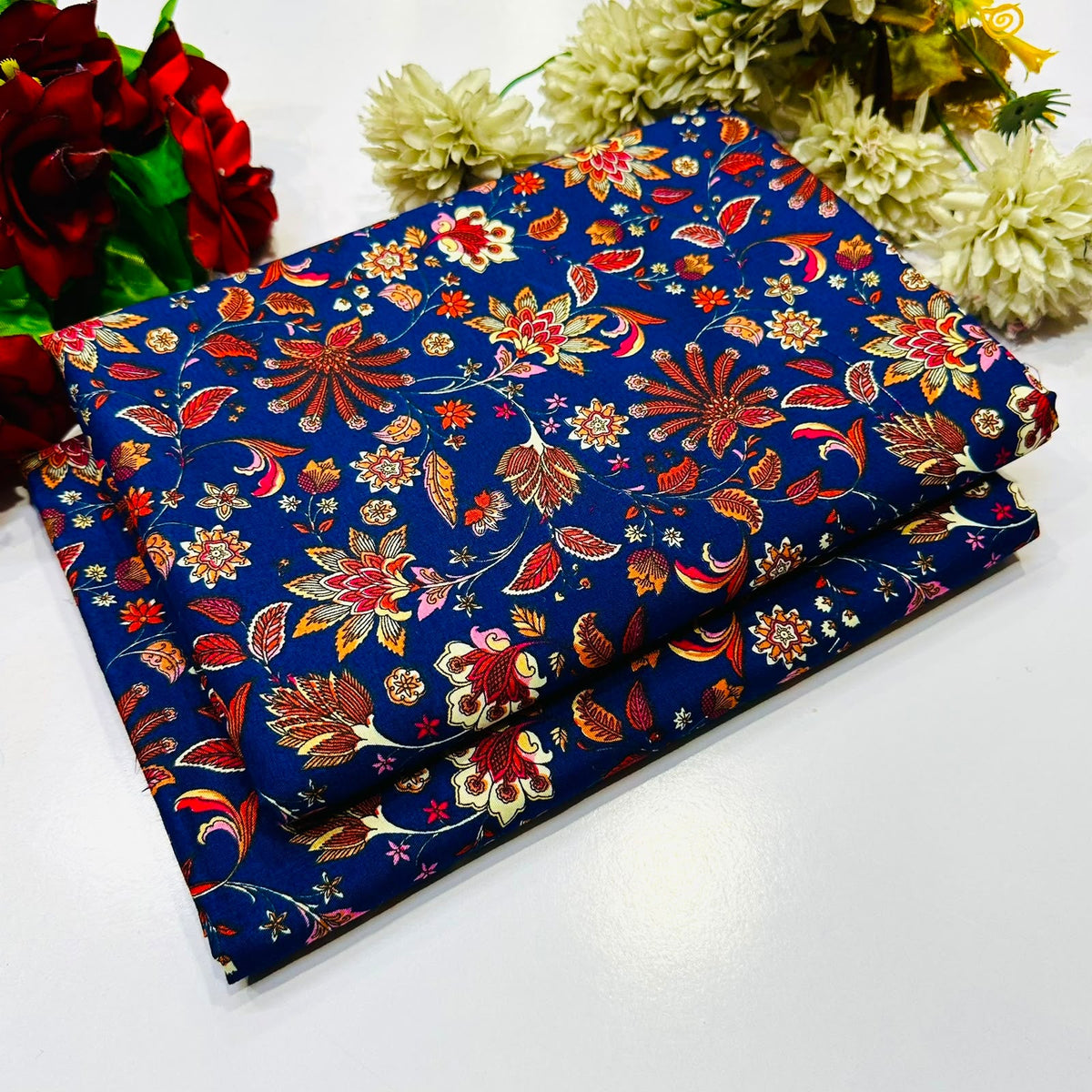 2 piece suit in navy bluec with a vibrant red, orange, and gold floral paisley pattern