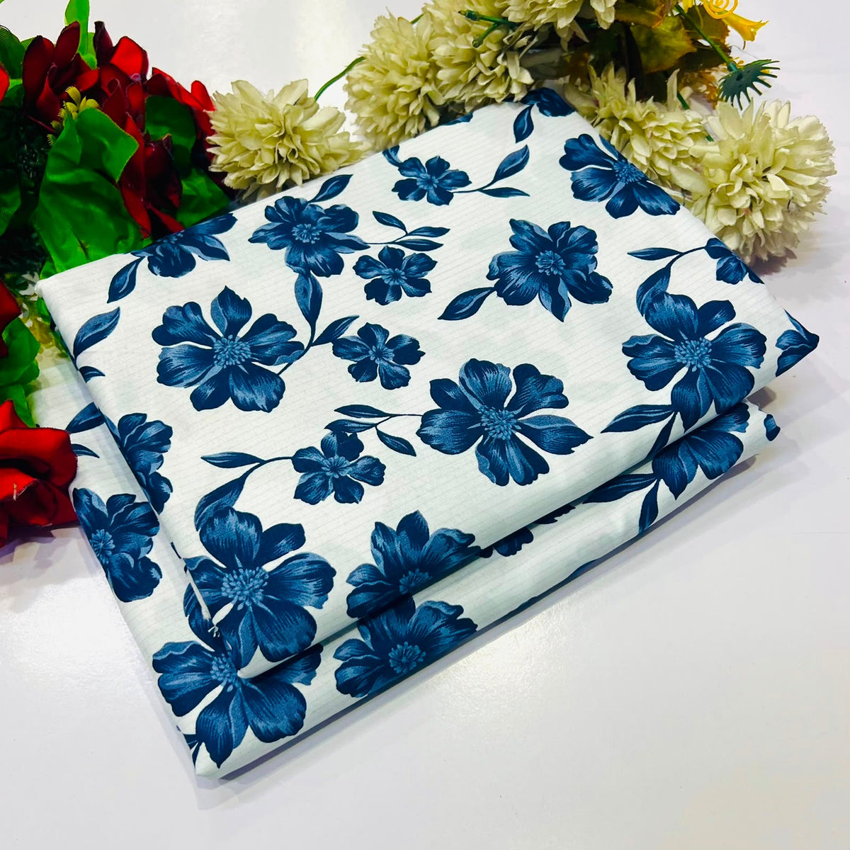 2 piece suit in white with a blue floral pattern