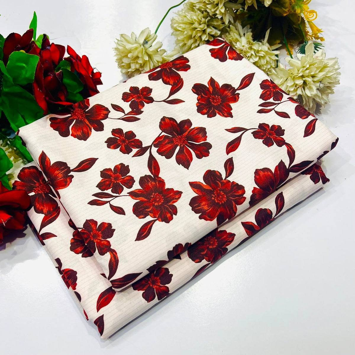 2 piece suit in cream-colored with a dark red floral pattern