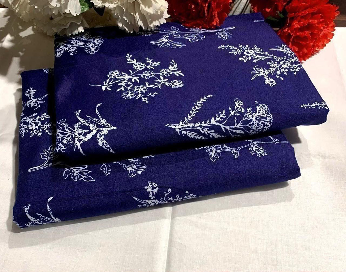 Ladies 2 piece suit in blue  swatches with white floral patterns 