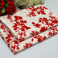 cream-colored 2 piece with a vibrant red floral vine pattern