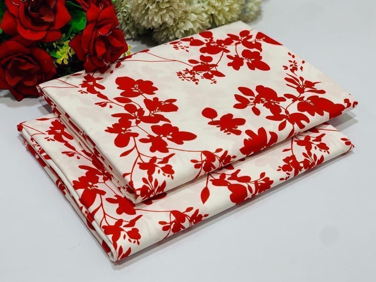 cream-colored 2 piece with a vibrant red floral vine pattern