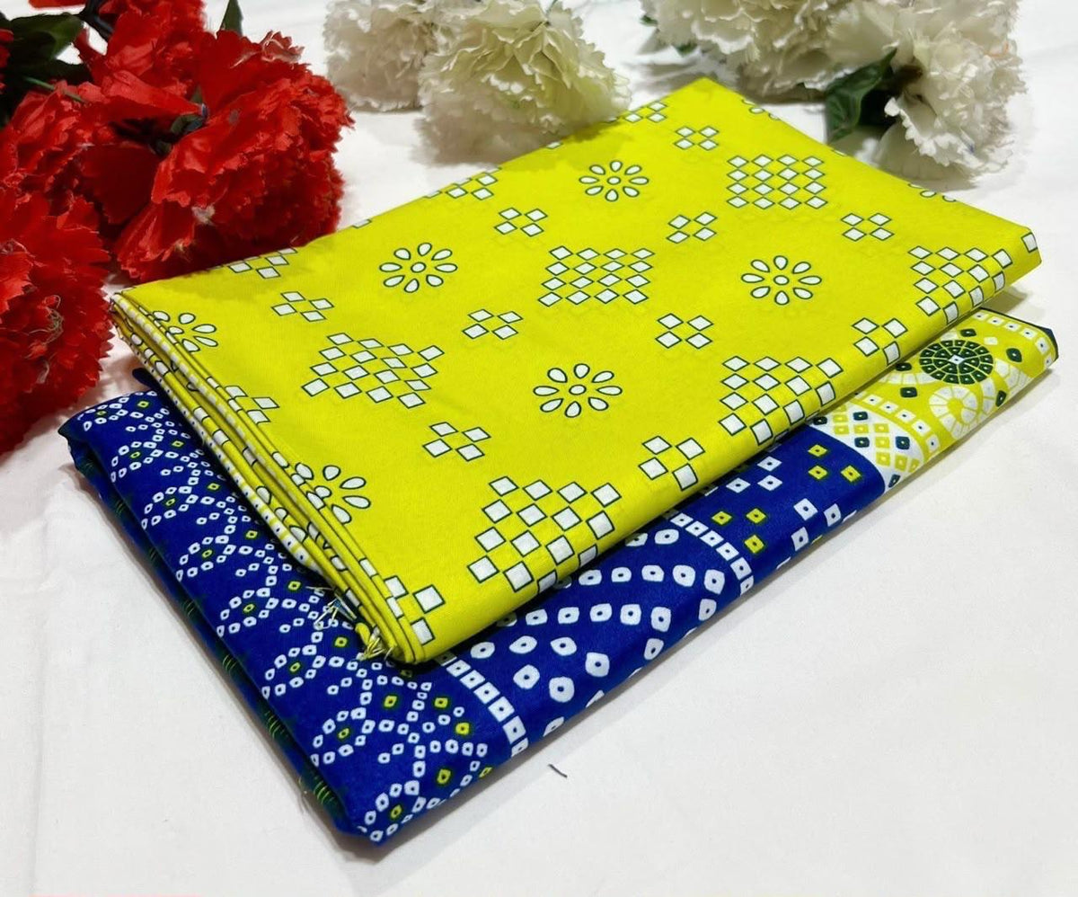 2 piece suit in bright yellow  and a blue fabric underneath with white patterns.